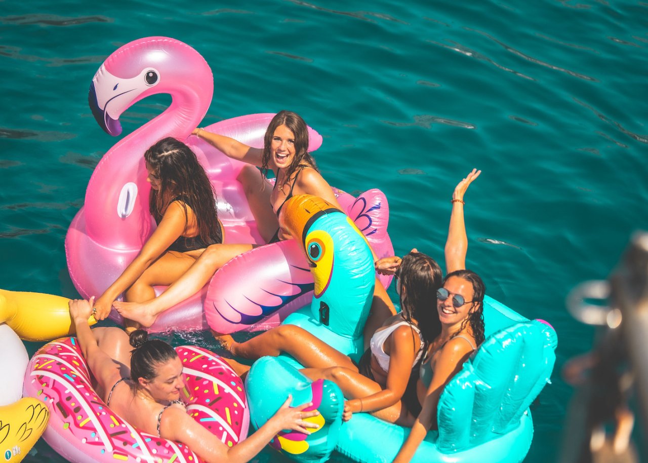 Group of people on inflatables at Floatilla party, Croatia  